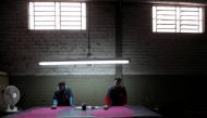 Brazilian workers give a colour on a piece of leather which will be used as leather to make shoes during a shoe-making process at a factory in Novo Hamburgo in the state of Rio Grande do Sul August 5, 2010.