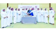 Officials cutting the cake during the ceremony.