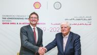 H E Dr. Ibrahim Ibrahim and Andrew Faulkner shaking hands.