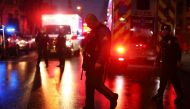 JERSEY CITY, NJ - DECEMBER 10: Emergency personnel are shown on the scene of a shooting that left multiple people dead on December 10, 2019 in Jersey City, New Jersey. In a raging gun battle that by some accounts lasted in excess of an hour, six people - 