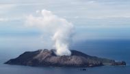 An aerial view of the Whakaari, also known as White Island volcano, as seen from Ohope beach in Whakatane, New Zealand, December 12, 2019. REUTERS/Jorge Silva