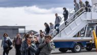 Relatives of people aboard the Chilean Air Force C-130 Hercules cargo plane that went missing in the sea between the southern tip of South America and Antarctica, arrive at Chabunco army base in Punta Arenas, Chile, on December 11, 2019. AFP / Joel Estay