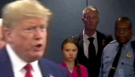 Swedish environmental activist Greta Thunberg watches as US President Donald Trump enters the United Nations to speak with reporters in a still image from video taken in New York City, US September 23, 2019. Reuters/Andrew Hofstetter