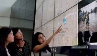 Nashin Mahtani (right) points to a flooding map in Jakarta, Indonesia in February 2017. Credit: Yayasan Peta Bencana
