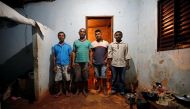 Paulo Santos de Jesus, Sales Felix, Joseilton de Jesus and Genivaldo Batista dos Santos pose for a picture after working on a coffee farm, during a labor ministry operation to identify workers in conditions analogous to slavery, in Campos Altos, Minas Ger
