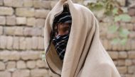 FILE PHOTO: Nineteen-year-old Taliban deserter hides his face in Kunduz province, Afghanistan December 4, 2019. Picture taken on December 4, 2019. REUTERS
