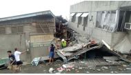 Rescue crew members look for trapped victims at collapsed building at Padada market, in Padada Philippines December 15, 2019 in this still image obtained from social media video. VINCENT YAJ MAKIPUTIN/via REUTERS 