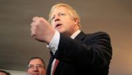 Britain's Prime Minister Boris Johnson gestures as he speaks to supporters on a visit to meet newly elected Conservative party MP for Sedgefield, Paul Howell, at Sedgefield Cricket Club in County Durham, north east England on December 14, 2019, following 