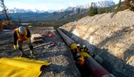 FILE PHOTO: Workers construct the Anchor Loop section of Kinder Morgans Trans Mountain pipeline expansion in Jasper National Park in a 2009 photo. (Kinder Morgan Canada handout via Reuters)
 
 