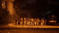 Policemen patrol outside the Jamia Milia University following a protest against a new citizenship law, in New Delhi, India, December 15, 2019. Reuters/Adnan Abidi
 