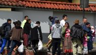 Migrants deported from the United States are seen outside the air force base upon their arrival in Guatemala City on December 12, 2019. AFP / Orlando Estrada 