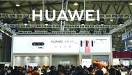 This file photo taken on June 11, 2019 shows people gathering at a Huawei stand during the Consumer Electronics Show, Ces Asia 2019 in Shanghai. AFP