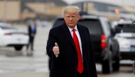 FILE PHOTO: U.S. President Donald Trump gestures as he arrives to board Air Force One at Joint Base Andrews, Maryland, U.S., December 14, 2019. REUTERS/Tom Brenner/File Photo