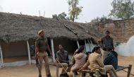 Members of police are seen near the house of a 23-year-old rape victim, who died in a New Delhi hospital last week after she was set on fire by a gang of men, which included her alleged rapists, in Unnao, in the northern state of Uttar Pradesh, India Dece