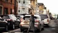 A member of the Jewish community crosses the street near the JC Kosher Supermarket on December 11, 2019 in Jersey City, New Jersey. Rick Loomis/Getty Images/AFP
