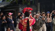 People watching a Beijing Opera performance during the 7th annual Wuzhen Theatre Festival in Wuzhen in Zhejiang province, two hours from Shanghai on October 28, 2019. AFP / Hector Retamal