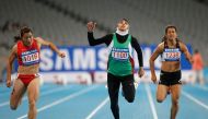 Iran's Maryam Toosi (C), wearing a hijab, competes with China's Yuan Qiqi (L) and Turkmenistan's Valentinae Meredova during the women's 100m heats at the Incheon Asiad Main Stadium during the 17th Asian Games September 27, 2014. Reuters/Kim Kyung-Hoon 