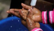 A Congolese child washes her hands as a preventive measure against Ebola at the Church of Christ in Mbandaka, Democratic Republic of Congo, May 20, 2018. Reuters / Kenny Katombe