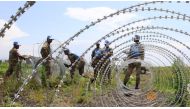 The South Africa contingent of the UN peacekeepers in Congo erect a razor wire barrier around Goma airport in the Democratic Republic of Congo, November 26, 2012. Reuters / James Akena
