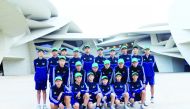 Dalian Professional FC’s Under 14 side training in Doha as part of a week long football tour of Qatar pose for a group picture.
