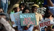 In this file photo taken on December 19, 2019 students and demonstrators hold placards during a protest against India's new citizenship law in Chennai. . / AFP / Arun SANKAR /