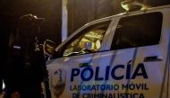 Forensic police arrive to the penitentiary of Tela after a fight between rival gangs ocurred in the prison. December 21, 2019/ AFP / STR