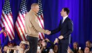 Democratic presidential candidate Pete Buttigieg shakes hands with actor Kevin Costner as he receives his endorsement during a campaign event at a high school in Indianola, Iowa, U.S. December 22, 2019. (REUTERS/Rachel Mummey)