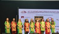 Students of Pakistan International School-Qatar performing at Lusail Multipurpose Hall during Qatar National Day celebrations. 
