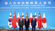 China's Premier Li Keqiang, Japan's Prime Minister Shinzo Abe and South Korea's President Moon Jae-in pose for pictures ahead of the 8th trilateral leaders' meeting in Chengdu, Sichuan province, China December 24, 2019. China Daily via Reuters