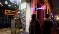 Two women walk past the Museum of Hangovers in Zagreb, on December 3, 2019. AFP / Denis Lovrovic
 