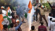 Congress-JMM alliance workers celebrate results projecting an assembly majority in the Jharkhand state election in Ranchi on December 23, 2019.  AFP / Rajesh Kumar
 