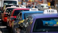 Taxis line up for passengers in Baltimore MD on March 26, 2018. AFP / David Gannon