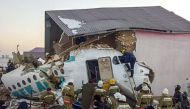 This handout picture taken on December 27, 2019 and released by Kazakhstan's emergencies committee shows resquers working at the site of a passenger plane crash outside Almaty. ( AFP / Kazakhstan's emergencies committee)