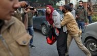 A policewoman tries to detain a demonstrator during a protest against a new citizenship law, in New Delhi, India, December 27, 2019. Reuters/Anushree Fadnavis
 