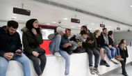 Lebanese protesters occupy a branch of BLC Bank in Beirut on December 28, 2019 in protest against nationwide imposed restrictions on dollar withdrawals and transfers abroad in an attempt to conserve dwindling foreign currency reserves.   AFP / ANWAR AMRO
