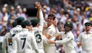 Australia's bowler Pat Cummins (C) celebrates with teammates after dismissing New Zealand batsman Henry Nicholls on the third day of the second cricket Test match against Australia at the MCG in Melbourne on December 28, 2019./ AFP / WILLIAM WEST / 
