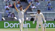 Australia's Pat Cummins (L) appeals for an LBW decision against New Zealand batsman Tom Blundell (R) on the fourth day of the second cricket Test match at the MCG in Melbourne on December 29, 2019./ AFP / WILLIAM WEST /