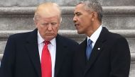 US President Donald Trump speaks to former President Barack Obama after inauguration ceremonies at the US Capitol on January 20, 2017, in Washington. AFP / Robyn Beck