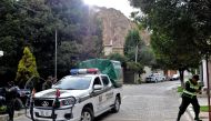 A police vehicle is seen at the entrance of La Rinconada gated community, where the Mexican embassy is located, in La Paz on Dcember 31, 2019. AFP / Jorge Bernal
 