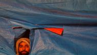 A demonstrator listens to a speaker during a protest against a new citizenship law, in New Delhi, India, December 31, 2019. Reuters/Adnan Abidi