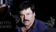 Recaptured drug lord Joaquin El Chapo Guzman is escorted by soldiers at the hangar belonging to the office of the Attorney General in Mexico City, January 8, 2016. Reuters / Henry Romero