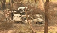 Cars destroyed by bushfires are seen in Mogo near Batemans Bay in New South Wales on January 2, 2020. AFP / PETER PARKS