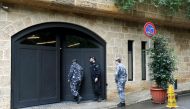 Lebanese police officers are seen at the entrance to the garage of what is believed to be former Nissan boss Carlos Ghosn's house in Beirut, Lebanon December 31, 2019. REUTERS/Mohamed Azakir
