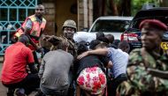  In this file photo taken on January 15, 2019 Special forces protect people at the scene of an explosion at a hotel complex in Nairobi's Westlands suburb.  AFP / Luis Tato