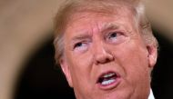 US President Donald Trump speaks to the press outside the grand ballroom as he arrives for a New Year's celebration at Mar-a-Lago in Palm Beach, Florida on December 31, 2019. AFP / Jim Watson