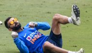 India's captain Virat Kohli stretches as he attends a training session ahead of the first T20 international cricket match of a three-match series between India and Sri Lanka, at the Assam Cricket Association Stadium in Barsapara in Guwahati on January 4, 