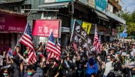 Pro-democracy protesters march along a street during a demonstration against parallel trading in Sheung Shui in Hong Kong on January 5, 2020. AFP / ISAAC LAWRENCE