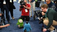 An attendee interacts with Lovot the companion robot by Grooxe X, during the CES Unveiled event at the 2020 Consumer Electronics Show (CES) in Las Vegas, Nevada, on January 5, 2020. AFP / Robyn Beck 