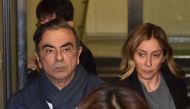 (FILES) This file photo taken on April 3, 2019 shows former Nissan chairman Carlos Ghosn (L) and his wife Carole (R) leaving the office of his lawyer in Tokyo. Prosecutors in Japan have obtained an arrest warrant for Carole Ghosn, wife of former Nissan ch
