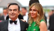Carlos Ghosn (L) and his wife Carole arriving for the screening of the film 'L'Amant Double' (Amant Double) at the 70th edition of the Cannes Film Festival in Cannes, on May 26, 2017. AFP / Loic Venance
 